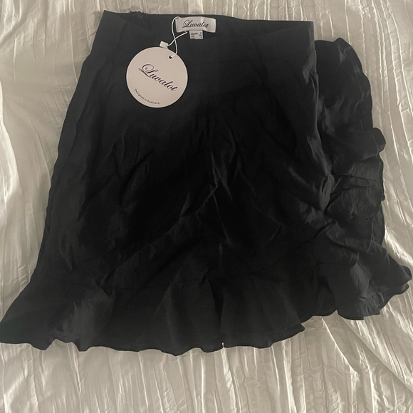 NWT Australian brand Luvalot black ruffle miniskirt with side zipper. 
Size 4 - Picture 3 of 5